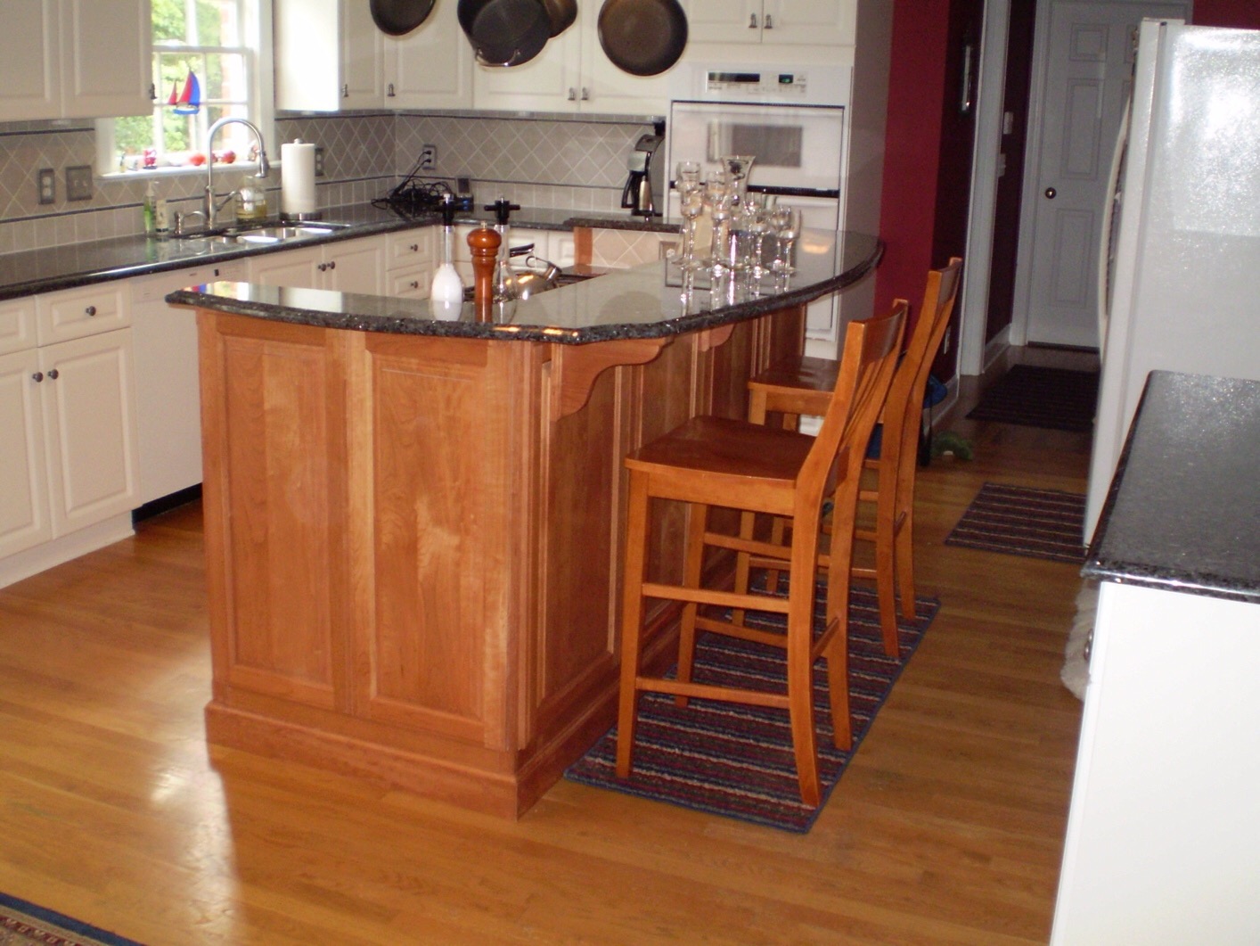 Refaced kitchen cabinets with updated doors and hardware in a bright San Antonio home